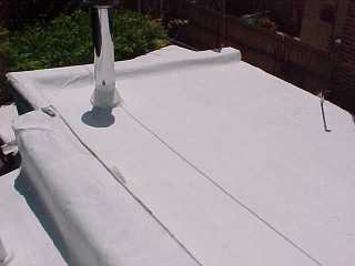 Flashing work ties in the roofing work in a Baltimore cool roof applied by Roof Menders.